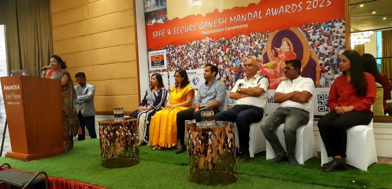 Dignitaries and Fire Brigade officials on stage at the felicitation ceremony