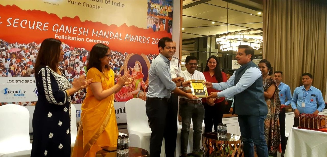 Award handover on stage at the FSAI Pune Chapter felicitation ceremony